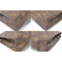 Louis Vuitton Clutch aus Canvas in Braun