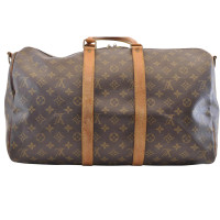 Louis Vuitton Keepall in Tela in Marrone