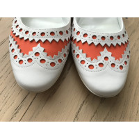 Hermès Slipper/Ballerinas aus Leder in Orange