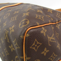 Louis Vuitton Keepall in Tela in Marrone