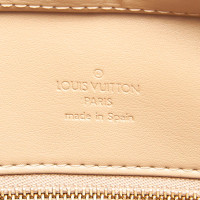Louis Vuitton Houston Leer in Geel