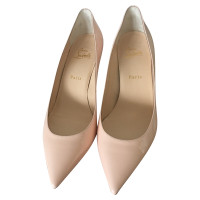 Christian Louboutin pumps in the nude
