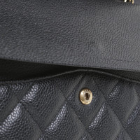 Chanel Classic Flap Bag Maxi in Pelle in Nero