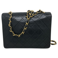 Chanel Classic Flap Bag New Mini en Cuir en Noir