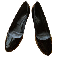 Tod's Chaussures compensées en Cuir verni en Noir