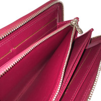 Louis Vuitton "Zippy Epi leather" in Fuchsia