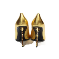 Yves Saint Laurent Pumps/Peeptoes aus Leder in Gold