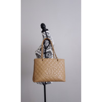 Chanel Grand  Shopping Tote en Cuir en Beige