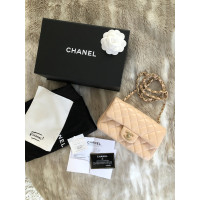 Chanel Classic Flap Bag New Mini Leer in Beige