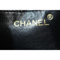 Chanel Sac à bandoulière en Cuir verni en Noir