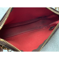 Louis Vuitton Pochette Accessoires aus Leder in Braun