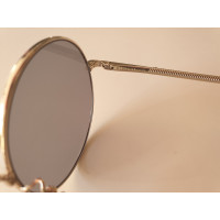 Nina Ricci Sonnenbrille in Gold