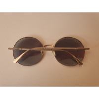 Nina Ricci Sunglasses in Gold