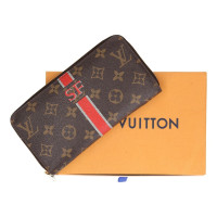 Louis Vuitton Täschchen/Portemonnaie aus Canvas in Rot