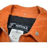 Versace Jacke/Mantel aus Baumwolle in Orange