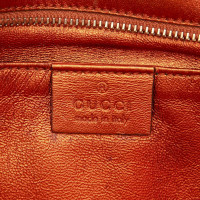 Gucci Clutch aus Leder in Orange