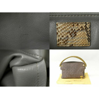 Louis Vuitton Whisper Bag aus Wildleder in Grau