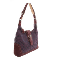 Coach Handtasche aus Canvas in Violett