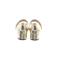 Christian Dior Pumps/Peeptoes aus Lackleder in Gold