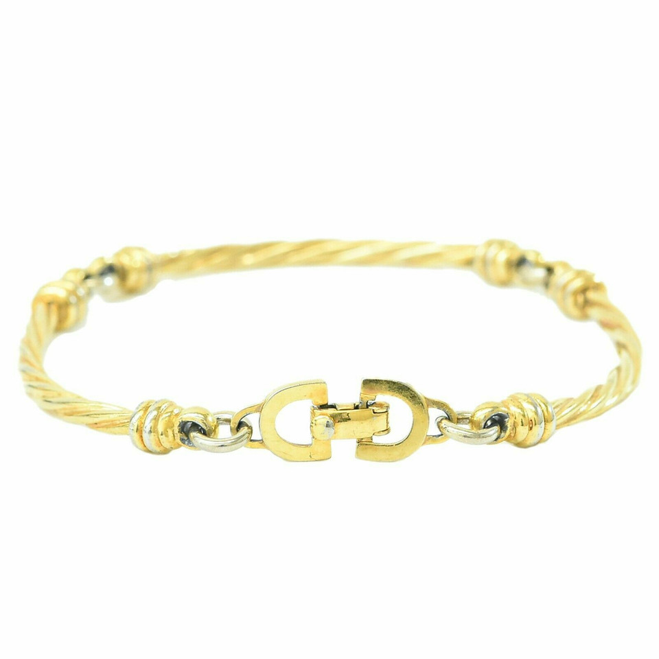 Christian Dior Armreif/Armband aus Vergoldet in Gold