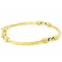 Christian Dior Armreif/Armband aus Vergoldet in Gold
