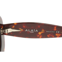 Alaïa Lunettes de soleil en Marron