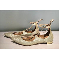 Aquazzura Slippers/Ballerina's Leer in Goud