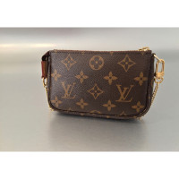 Louis Vuitton Pochette Accessoires aus Leder in Braun