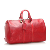 Louis Vuitton Sac de voyage en Cuir en Rouge