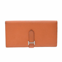 Hermès Täschchen/Portemonnaie aus Leder in Orange