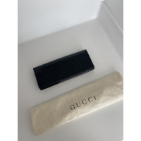 Gucci Clutch aus Lackleder in Schwarz