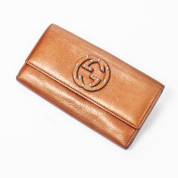 Gucci Täschchen/Portemonnaie aus Leder in Gold