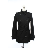 Burberry Jacke/Mantel aus Baumwolle in Schwarz