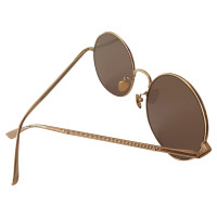 Nina Ricci Sunglasses in Gold