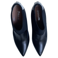 Pollini Pumps/Peeptoes aus Leder in Schwarz