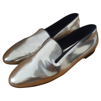 Tod's Slipper/Ballerinas aus Leder in Gold