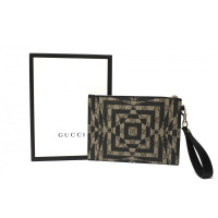 Gucci clutch from GG Supreme canvas