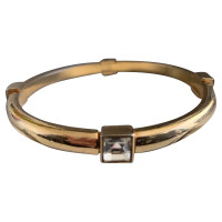 Christian Dior Armreif/Armband aus Metall in Gold