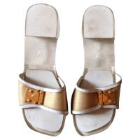 Louis Vuitton Sandals in Gold