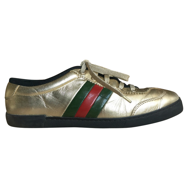 gold gucci trainers