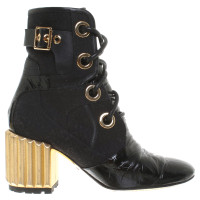 Christian Dior Ankle boots in black / gold