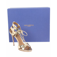 Aquazzura Sandalen aus Leder in Gold