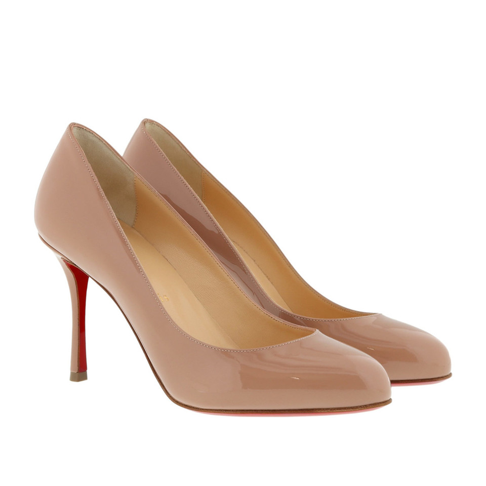 Christian Louboutin Pumps/Peeptoes en Cuir verni en Nude