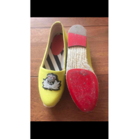 Christian Louboutin Slippers/Ballerina's Canvas in Geel