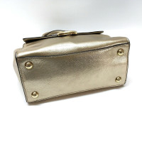 Michael Kors Handtasche aus Lackleder in Gold