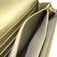 Cartier Täschchen/Portemonnaie aus Lackleder in Gold