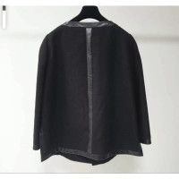 Chanel Anzug aus Wolle in Schwarz