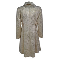 Moschino Jacke/Mantel aus Baumwolle in Gold