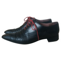 Miu Miu Chaussures à lacets en Cuir en Noir
