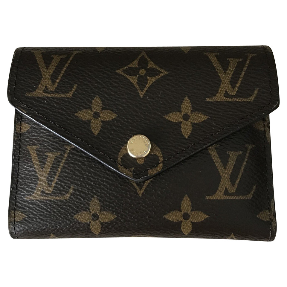 Louis Vuitton Täschchen/Portemonnaie aus Canvas in Braun